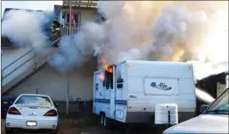  ?? Penticton Herald ?? A travel trailer parked at the rear of 667 Ellis St., was also damaged in the fire on Tuesday morning.