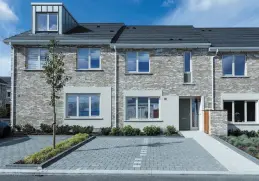  ??  ?? Exterior of the three-bed Ash house type (above), the most affordable in the scheme; (left) bedroom in the four-bed mid-terrace Heron style and (right) the kitchen in one of the Ash houses