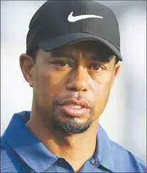 ?? AP PHOTO ?? In this Feb. 2 file photo, Tiger Woods reacts on the 10th hole during the first round of the Dubai Desert Classic golf tournament in Dubai, United Arab Emirates.