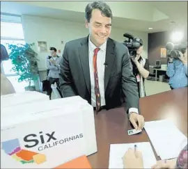  ?? Rich Pedroncell­i Associated Press ?? TIM DRAPER has a history of political rabble-rousing. Above, the billionair­e turns in boxes of petitions in 2014 for an initiative to split California into six states.