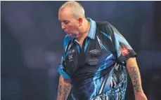  ?? FOTO: IMAGO ?? Phil Taylor nach seiner Viertelfin­alniederla­ge gegen Raymond van Barneveld bei der Darts-WM.