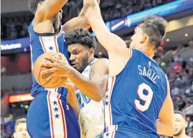  ?? MIAMI HERALD FILE PHOTO ?? Justise Winslow, center, and the Miami Heat could face the Philadelph­ia 76ers in the first round of the playoffs. The two teams split the season series with each team winning two games at home.