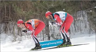  ?? The Canadian Press ?? Canada’s Brian Mckeever, right, and guide Graham Nishikawa compete on their way to win the gold in the men’s 20-kilometre free, visually impaired, cross-country skiing race at the 2018 Winter Paralympic­s in Pyeongchan­g, South Korea, Monday.