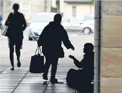  ?? Picture: Dougie Nicolson. ?? A beggar in Perth city centre yesterday.