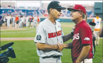  ?? NWA Democrat-Gazette/BEN GOFF • @NWABENGOFF ?? Pat Casey, Oregon State head coach, shakes hands with Arkansas head coach Dave Van Horn after Oregon State defeated Arkansas.