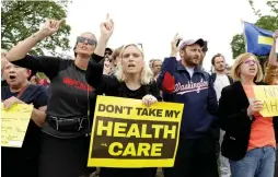  ?? (Reuters) ?? DEMONSTRAT­ORS PROTEST in front of Washington’s US Capitol in May after the House of Representa­tives approved a bill to repeal major parts of Obamacare and replace it with a Republican health-care plan.