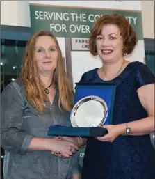  ??  ?? Catherine Sheehan (left), winner of the Sports Photograph of the Year and Ber Hunter, winner of the Community Photograph of the Year being presented with their awards by Marie Barry of the AIB in Fermoy.