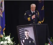  ?? DAVID SAMSON — FORUM COMMUNICAT­IONS CO. VIA AP, POOL ?? Fargo Police Chief David Zibolski speaks during funeral services for Officer Jake Wallin at Pequot Lakes High School in Pequot Lakes, Minn., on Saturday. Wallin, 23, was killed July 14 when a man armed with 1,800 rounds of ammunition, multiple guns and explosives ambushed officers responding to a routine traffic crash.