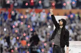 ?? Rob Carr/TNS ?? Eminem performs during the Pepsi Super Bowl halftime show at SoFi Stadium on Feb. 13, 2022, in Inglewood, Calif.