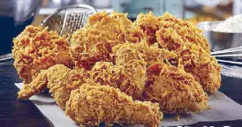  ??  ?? Popeyes’ signature fried chicken