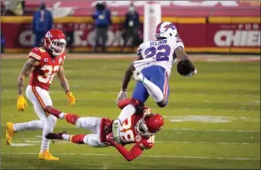  ?? The Associated Press ?? Kansas City Chiefs safety L’Jarius Sneed tackles Buffalo Bills running back T.J. Yeldon as safety Tyrann Mathieu watches on Sunday in Kansas City, Mo.