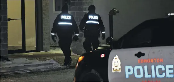  ?? ED KAISER/POSTMEDIA ?? Police attend the scene of a suspicious death at a low-rise complex on 51st Street on Monday.