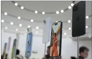  ?? (AP) ?? IPhone 15 phones are displayed during an announceme­nt of new products on the Apple campus in Cupertino, Calif., in September.