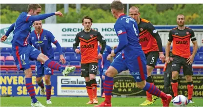  ??  ?? Two easy: Nick Ross drives home Inverness Caley’s second goal as three United players watch helplessly