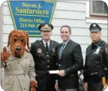  ??  ?? State Rep. Steve Santarsier­o at his district office with Chief Ken Coluzzi and Officer Michael Pell of Lower Makefield Twp. Police Department, as well as McGruff the Crime Dog, following Santarsier­o’s donation to DARE on Jan. 17.
