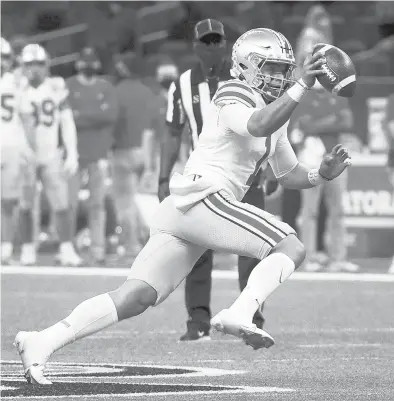  ?? CHRIS GRAYTHEN/GETTY ?? QB Justin Fields made a big impression with six TD passes in Ohio State’s semifinal victory over Clemson.