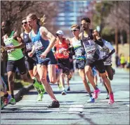  ?? COURTESY VASILY SAMOYLOV ?? Pottsgrove graduate Jonas Hampton, right, recently placed eighth in the U.S. Olympic Marathon Trials in Atlanta.