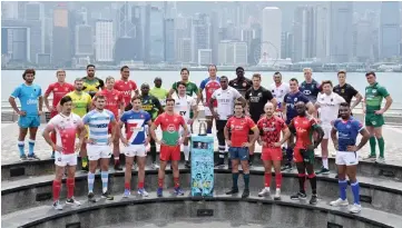  ?? — AFP photo ?? Captains of teams competing in the annual Hong Kong Rugby Sevens pose with the winner’s trophy during a promotiona­l event ahead of the tournament.