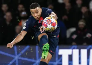  ?? — AFP file photo ?? Mbappe shoots the ball during a match.