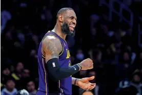  ?? YANNICK PETERHANS/ASSOCIATED PRESS FILE PHOTO ?? Los Angeles Lakers forward LeBron James celebrates during the second half of a Feb. 9 game against the New Orleans Pelicans in Los Angeles. James will participat­e in his 21st All-Star events this weekend.