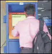  ?? HT ARCHIVES ?? As commuter uses ATVM at Kalyan station.