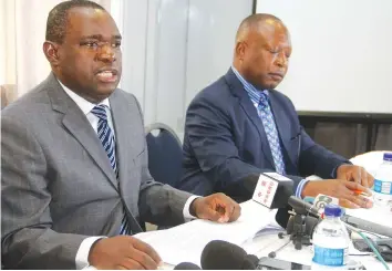  ?? — (Picture by Kudakwashe Hunda) ?? Foreign Affairs and Internatio­nal Trade Minister Retired Major-General Sibusiso Moyo (left) flanked by the ministry’s director for research and policy Mr Gideon Gapare, addresses Heads of Mission accredited to Zimbabwe in Harare yesterday.