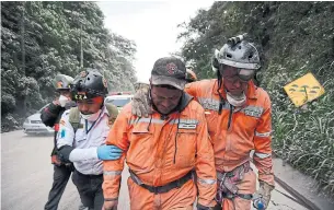  ?? ORLANDO ESTRADA/AFP/GETTY IMAGES ?? A volunteer firefighte­r cries after leaving El Rodeo village in Escuintla department, 35 kilometres south of Guatemala City on Sunday, following the eruption of the Volcano of Fire.