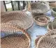  ??  ?? Traditiona­l sweetgrass basket weaving is a common sight at the Charleston City Market.