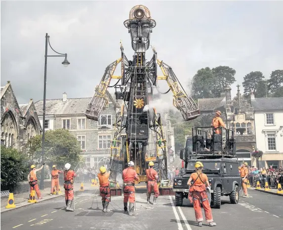  ?? Matt Cardy ?? > The 11.2-metre-tall Man Engine – the UK’s largest mechanical puppet – was unveiled to the public in Tavistock, Devon, on July 25, 2015