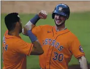  ?? GREGORY BULL — THE ASSOCIATED PRESS ?? The Houston Astros’ Kyle Tucker, right, celebrates his Game 6 sixth-inning solo home run with Carlos Correa.