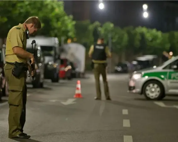  ??  ?? Officers explore the scene near where an explosion killed one man and injured 11 others (EPA)