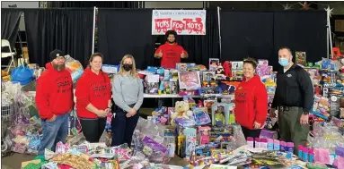  ?? PHOTOS COURTESY OF CITY MT. PLEASANT PUBLIC SAFETY FACEBOOK PAGE ?? Mt. Pleasant officials collect a large amount of Toys for Tots donations for the 2021 holiday season.