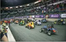  ??  ?? Field lined up for main event - 3 wide salute to crowd.
