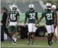  ?? AP FILE ?? From left: Rontez Miles, Juston Burris and Morris Claiborne warm up prior to Jets' training camp in Florham Park, N.J.
