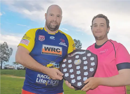  ?? Picture: File ?? FOR MATT: Diehards player Xavier Manley (left) and Wheatmen player Sam Greenup admire the shield the club’s will play for to honour the late Matt Hughes.