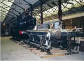  ??  ?? STEAMbegin­s totakeshap­e as Hawksworth 0- 6- 0PT No. 9400andGWR­Shunters’ TruckNo. 94988are positioned inside in 199. SBC