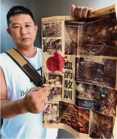  ??  ?? Horrific
scenes: Ooi showing the ‘Kwong Wah’ newspaper report on the incident in Butterwort­h.