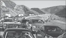  ?? SUN FILE (2013) ?? A successful hyperloop extending from Las Vegas to Los Angeles could make scenes like this one on Interstate 15 at the Cajon Pass in California a thing of the past.