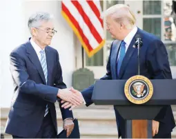  ??  ?? US President Donald Trump shakes hands with Jerome Powell, his nominee to become chairman of the US Federal Reserve at the White House in Washington, US, November 2, 2017. (Reuters)