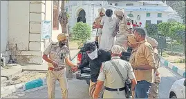  ?? HT PHOTO ?? The accused in a sacrilege case being taken to a court in Faridkot on Monday.