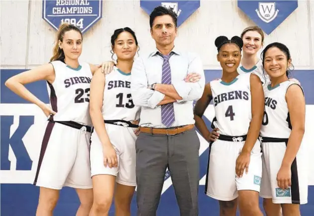  ?? DISNEY+ ?? John Stamos plays a former NCAA men’s basketball coach brought low by his own temper and now guides a girls basketball team at a private high school in “Big Shot.”