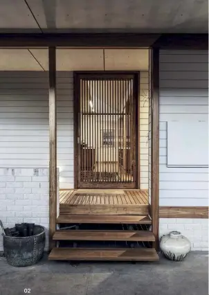  ??  ?? 02 The home’s primary entry point is at its side, positioned, with rural modesty, adjacent to the driveway.
03 A series of timber battened screens mediates between the home’s interior and exterior zones.