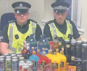  ??  ?? On patrol Constables Bruce Heron (left) and Moray Stewart with some of the alcohol taken away