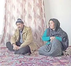  ??  ?? Haidari (left) and his wife Maryam Haidair who lost his son in an explosions on Nov 24 last year in the city of Bamiyan, speak during an interview with AFP at his house in Bamiyan province.