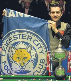  ?? Picture: Getty. ?? Leicester City fan Mark Selby had much to celebrate at the Crucible last night, winning the World Snooker crown shortly after his football favourites secured the Premier League title.