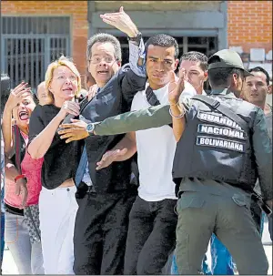  ?? AP/WIL RIERA ?? Loyal employees surround Venezuelan chief prosecutor Luisa Ortega (in white pants) as security forces block her from entering her office Saturday in Caracas after the new constituen­t assembly ousted her.