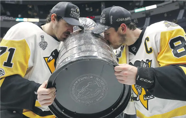  ?? — GETTY IMAGES FILES ?? Evgeni Malkin, left, and Sidney Crosby will return this season to try to make it three in a row for the first time since the New York Islanders of the early 1980s.