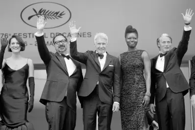  ?? AP PHOTOS ?? From left: Phoebe Waller-Bridge, director James Mangold, Harrison Ford, Shaunette Renee Wilson, and Mads Mikkelsen pose for photograph­ers upon arrival at the premiere of the film ‘Indiana Jones and the Dial of Destiny’ at the 76th internatio­nal film festival in Cannes, southern France, on Thursday.