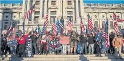  ?? VICTOR J. BLUE THE NEW YORK TIMES ?? Trump supporters gather at the Pennsylvan­ia State Capitol in Harrisburg, Penn., days after the election. Trump’s allies did plenty of legwork to promote the baseless conspiracy that would appeal to his most passionate supporters.