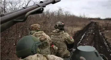  ?? ?? ▴
Ukrainian anti-aircraft gunners near Bakhmut.